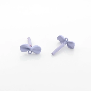 Detailed macro view of lavender matte finish butterfly jewelry charms with hanging loops