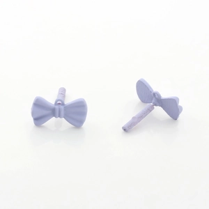 Close-up of lilac purple bow earring studs with a matte finish and metal pins