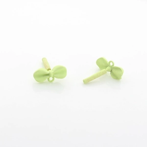 Detailed view of light green matte bow pendant for DIY jewelry making and earring design