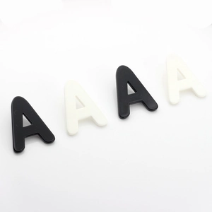 Fashionable black and white acrylic letter A earrings in a minimalist Korean style design