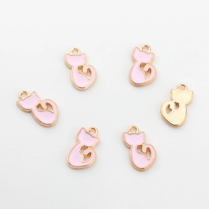 Detail of six pink enamel cat pendants with gold plating for DIY jewelry making