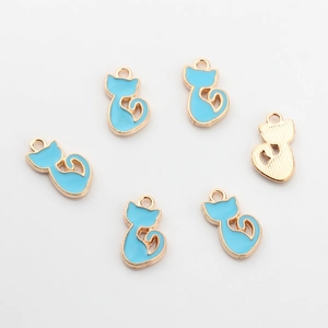 Detail of six blue enamel cat charms with golden alloy frames for DIY jewelry making
