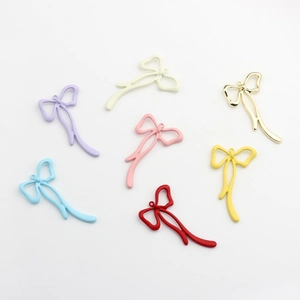 Colorful alloy bow pendants for DIY jewelry making in multiple vibrant painted finishes