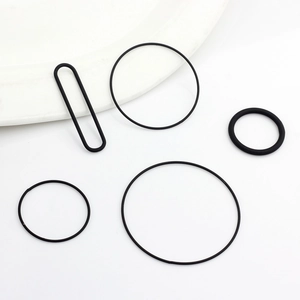 Detailed view of black elastic rubber rings in round and oval shapes for jewelry making