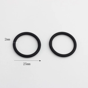 Close-up detail of two black 2mm thick O-ring rubber seals with 25mm diameter measurements