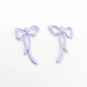 Detail shot of lavender matte alloy bow pendants with rings for DIY jewelry making