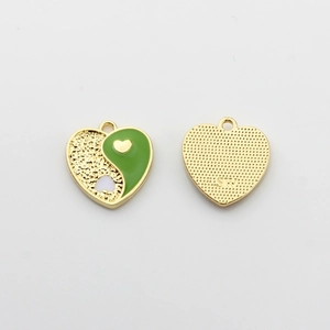 Detail of alloy heart charms with green enamel Yin Yang design and SW logo engraving