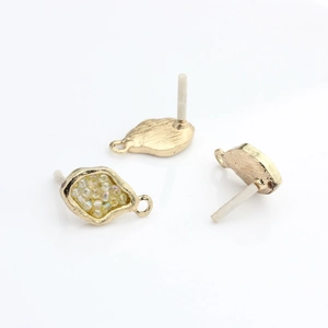 Detailed view of irregular organic gold-plated DIY earrings with micro bead inlay and loops