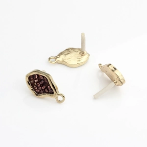 Detailed view of gold plated geometric earring posts with inlaid dark beads for DIY jewelry