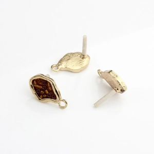 Detailed view of gold-plated geometric earring connectors with brown seed beads for DIY jewelry