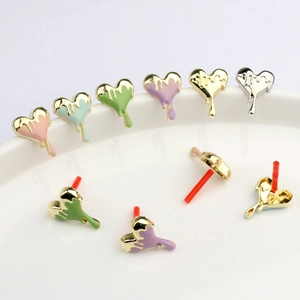 Lava heart enamel stud earrings in colorful macaron shades on a white porcelain tray