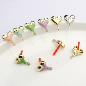 Detailed view of colorful heart-shaped drip oil enamel earrings in multiple pastel colors