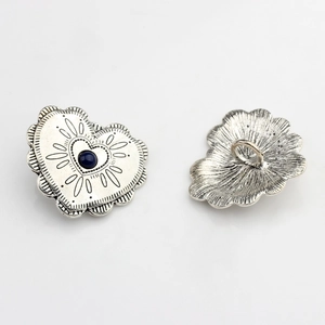Detailed view of vintage silver heart alloy buttons with blue beads for DIY jewelry