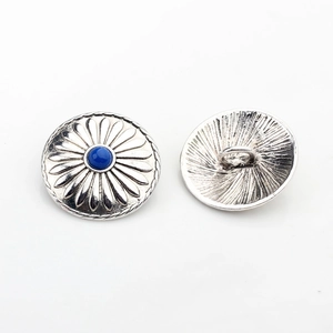 Detail of silver alloy sunflower buttons with blue center bead and sewing shank