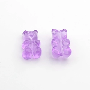 Detail of purple transparent resin bear pendants with back slots for DIY jewelry making