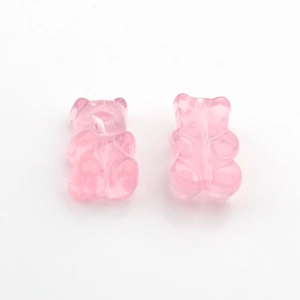 Macro detail of two pink translucent gummy bear charms made of high-quality resin