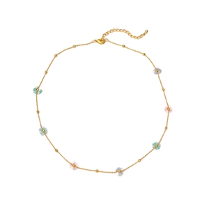 Colorful floral charm necklace in gold finish with pastel beads on a white background