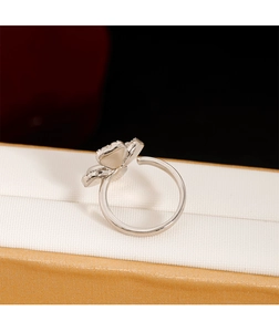 Macro view of adjustable cat eye clover ring with sparkling zircons on jewelry box