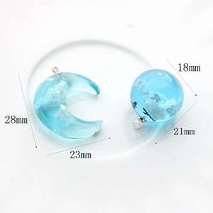 Blue sky and white cloud resin pendant set with crescent moon and round sphere shapes