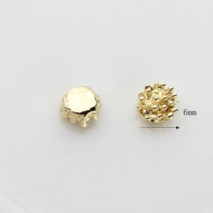 Golden 6mm textured flower stamen metal beads with granular urchin-like finish