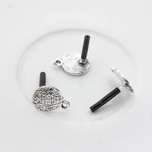 Detail view of silver alloy round earring posts with vintage textured grid and hanging loop