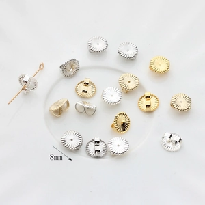 8mm flower-shaped 14K gold plated earring backs with radiant gear texture in gold and silver