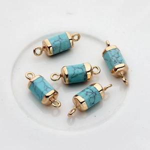 Detail of 5 turquoise column pendants with gold plated connectors for DIY jewelry