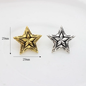Vintage star-shaped metal alloy charms in gold and silver finish for DIY jewelry