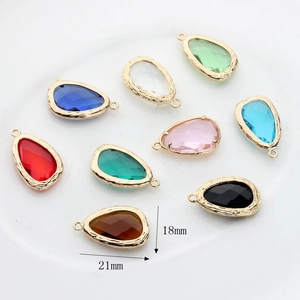 Faceted glass teardrop charms in various colors with 14K gold-plated textured frames