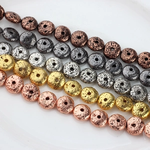 Plated volcanic lava stone donut beads in gold and silver for DIY jewelry making