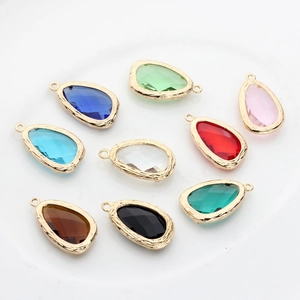 Set of 9 colorful teardrop faceted glass charms with 14K gold-plated textured metal frames