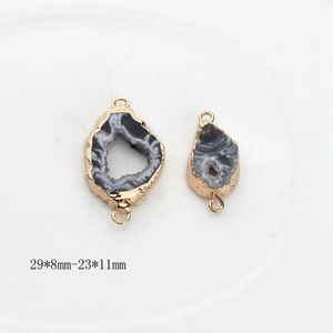Detailed view of natural agate slice pendants with gold edges and size measurements