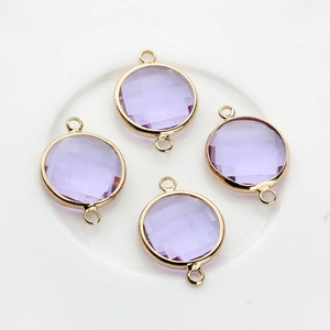 Detail of 16mm lavender faceted crystal charms with gold-plated double-hole metal frames