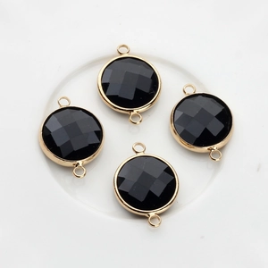 Detailed view of 16mm faceted black crystal connectors with golden copper frame edges