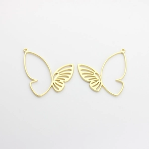 Detailed view of golden butterfly charms with hollow outlines for DIY jewelry making