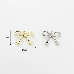 Cute bow alloy jewelry pendants in gold and silver colors with textured surface, 20mm