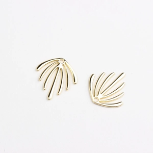 Detailed view of fan-shaped gold leaf pendants with smooth metallic finish and pre-drilled holes