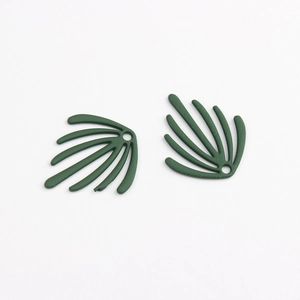 Detailed view of dark green leaf-shaped alloy charms with a smooth spray-painted finish