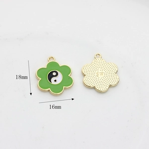 Detail of 18x16mm green flower Tai Chi pendant with gold back for DIY jewelry
