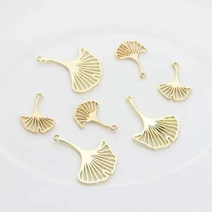 Golden ginkgo leaf pendants in two sizes with hollow metal texture for DIY jewelry making