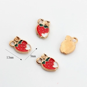 Detailed macro of strawberry alloy pendants with 13mm by 9mm dimension indicators