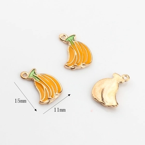 Detail view of 15mm banana-shaped enamel fruit charms for DIY jewelry making and crafts