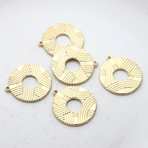 Set of five gold plated geometric hollow circle pendants with art deco textured patterns