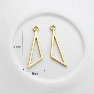 Detailed view of two gold hollow triangle charms with dimensions 29mm by 9mm