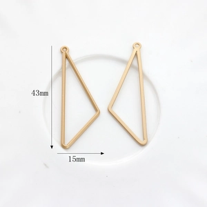Detail of matte gold irregular triangle charms for DIY jewelry with 43mm height scale