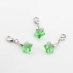 Three handmade crystal star pendants in light green with silver lobster clasps for kids