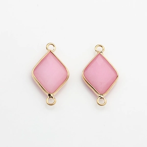 Macro shot of rhombus natural stone pendants with gold-plated edges for DIY jewelry making