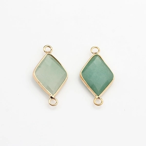 Macro view of rhombic green aventurine stone pendants with gold plated edges for DIY jewelry