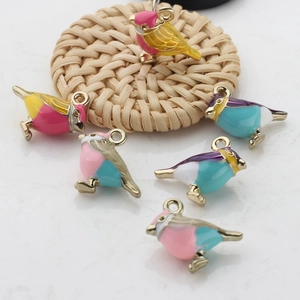 Handmade alloy bird charms with colorful enamel finish and gold-tone hanging loops