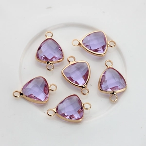 Detail of 6 purple triangular crystal charms with gold-plated double rings for DIY jewelry